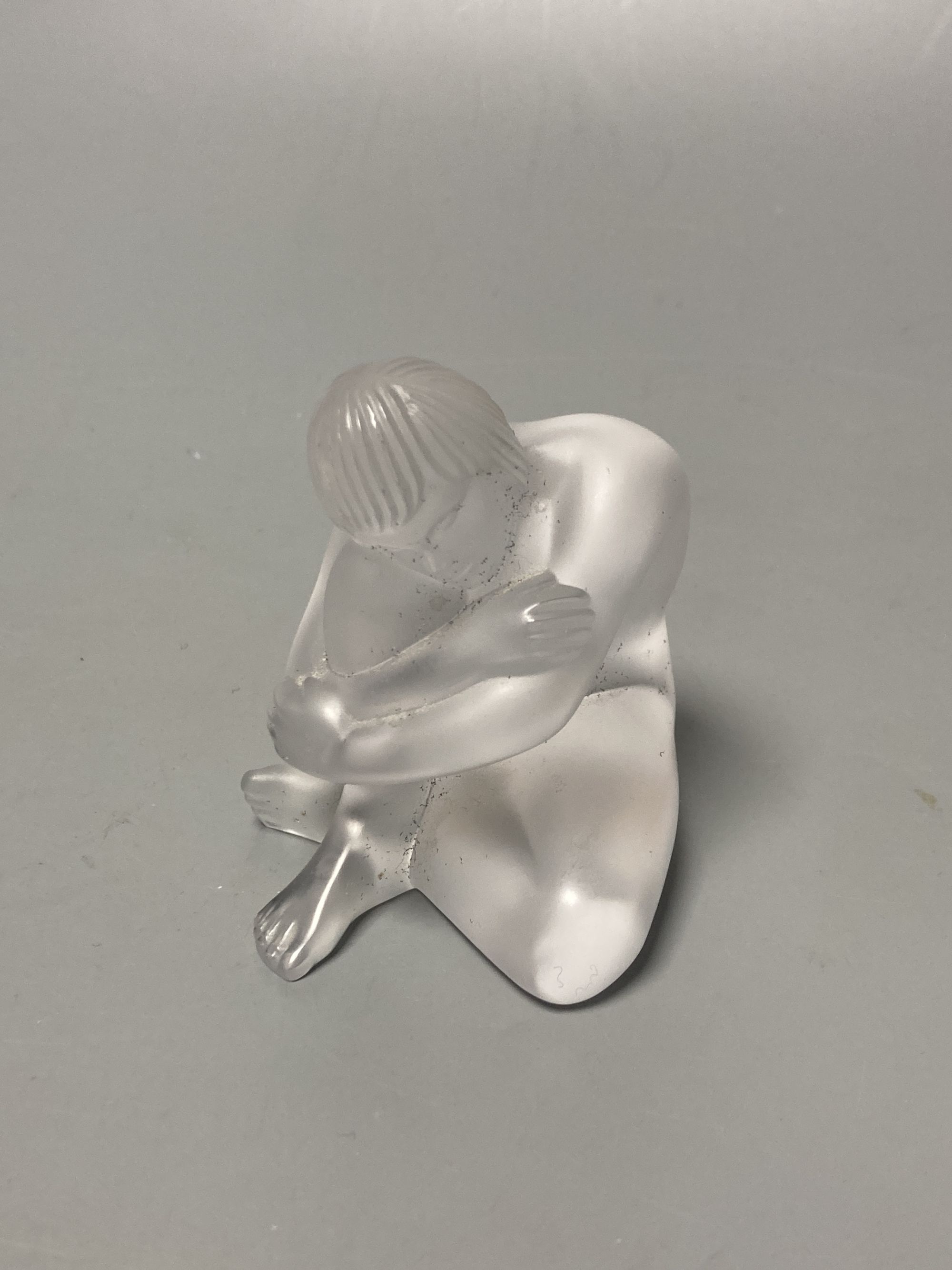 A Lalique seated figural paperweight, height 7cm, boxed